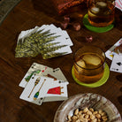 Camping playing cards on a dark wood coffee table at Addison West