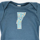 Vermont Baby Blue Bodysuit in Camp on a white background at Addison West