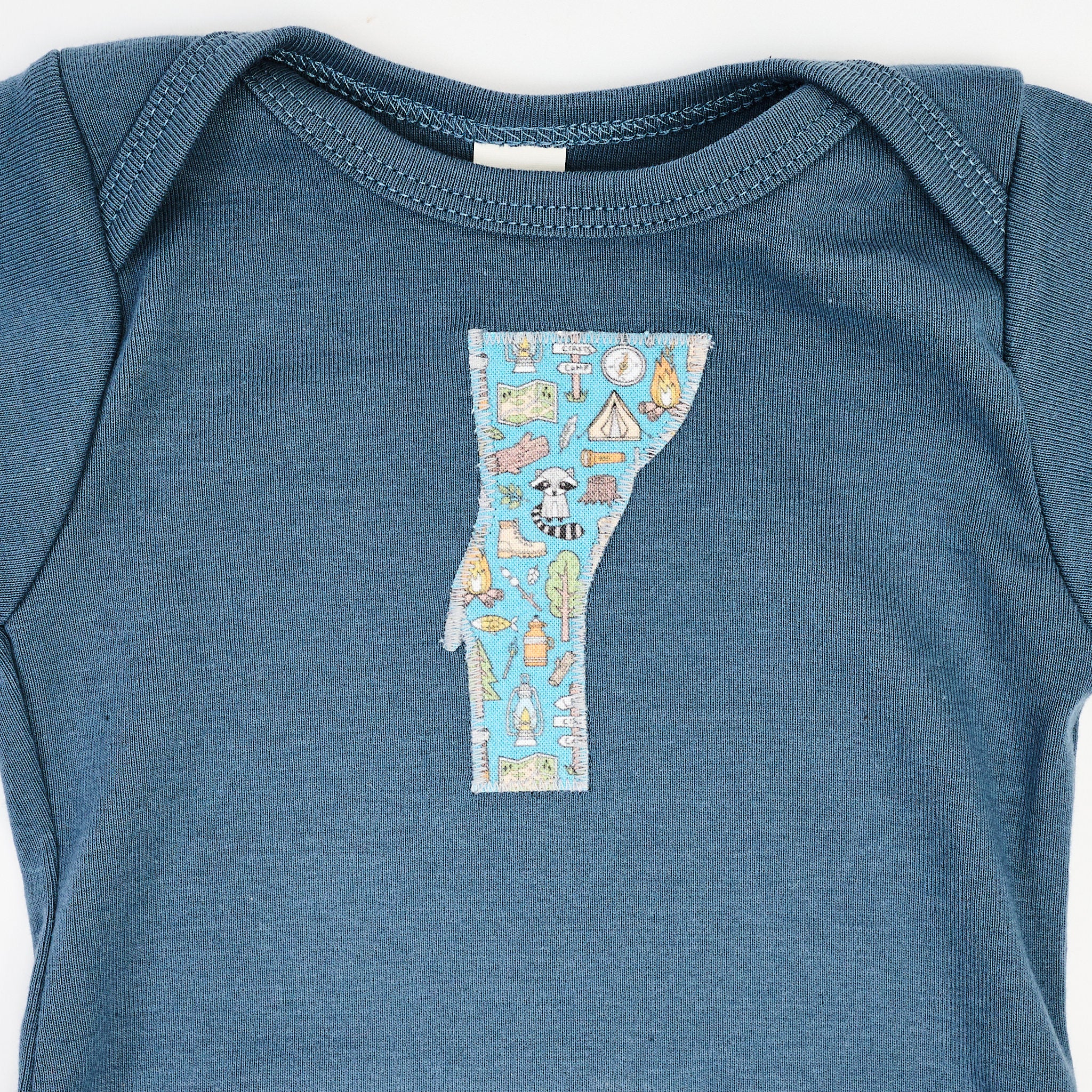 Vermont Baby Blue Bodysuit in Camp on a white background at Addison West