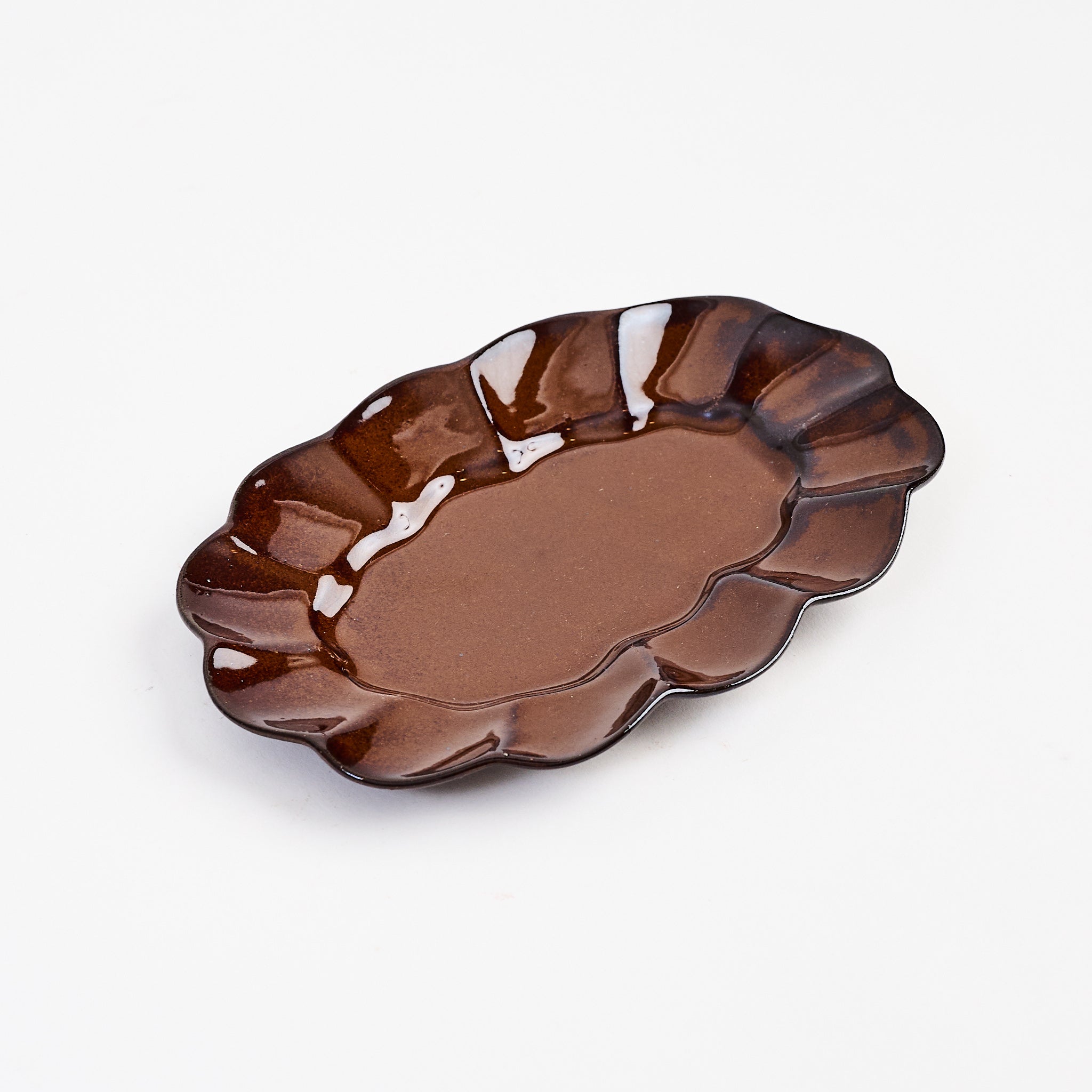 Stoneware Scalloped Oval Plate on a white background at Addison West