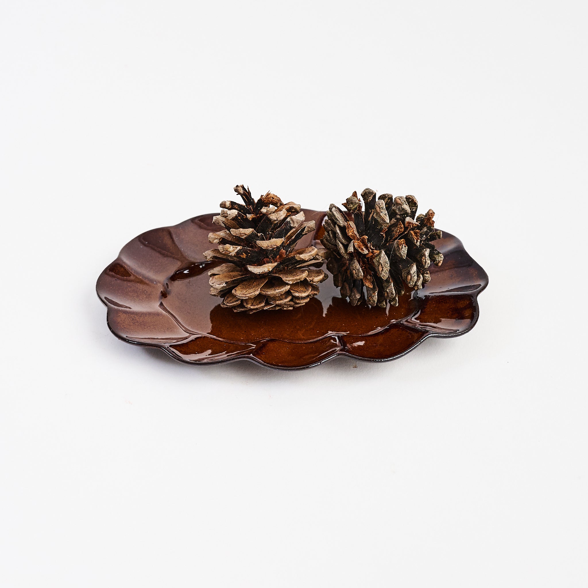Stoneware Scalloped Oval Plate on a white background at Addison West