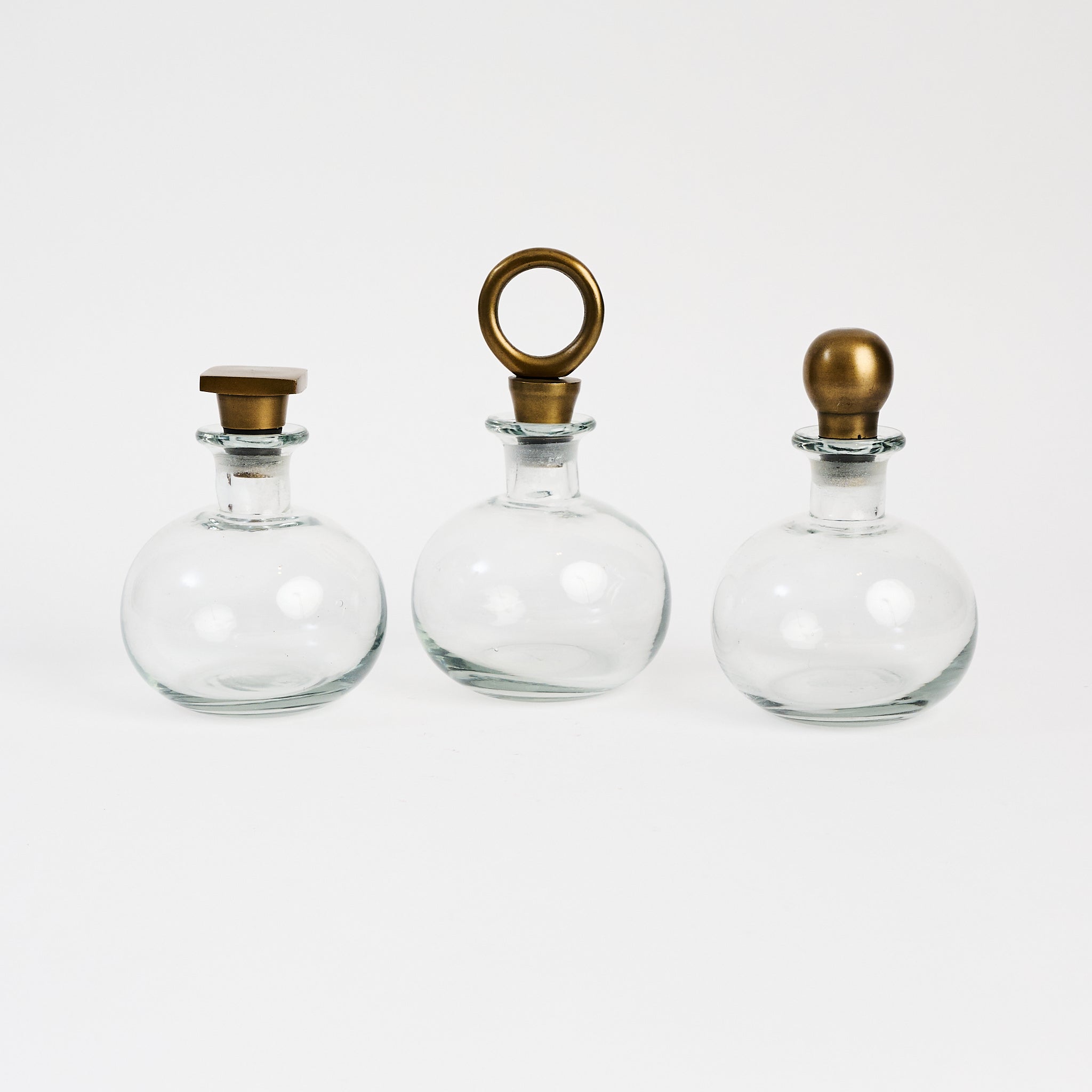 Carafes with shaped Stoppers on a white background at Addison West