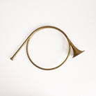 Vintage Brass French Horn on a white background at Addison West