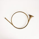 Vintage Brass French Horn on a white background at Addison West