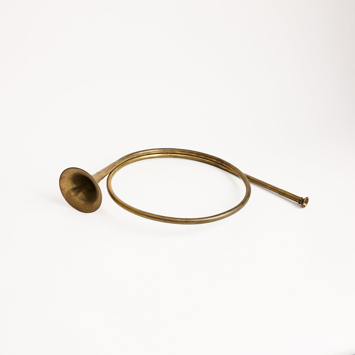 Vintage Brass French Horn on a white background at Addison West