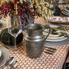 Vintage Pewter Pitcher on a table at Addison West