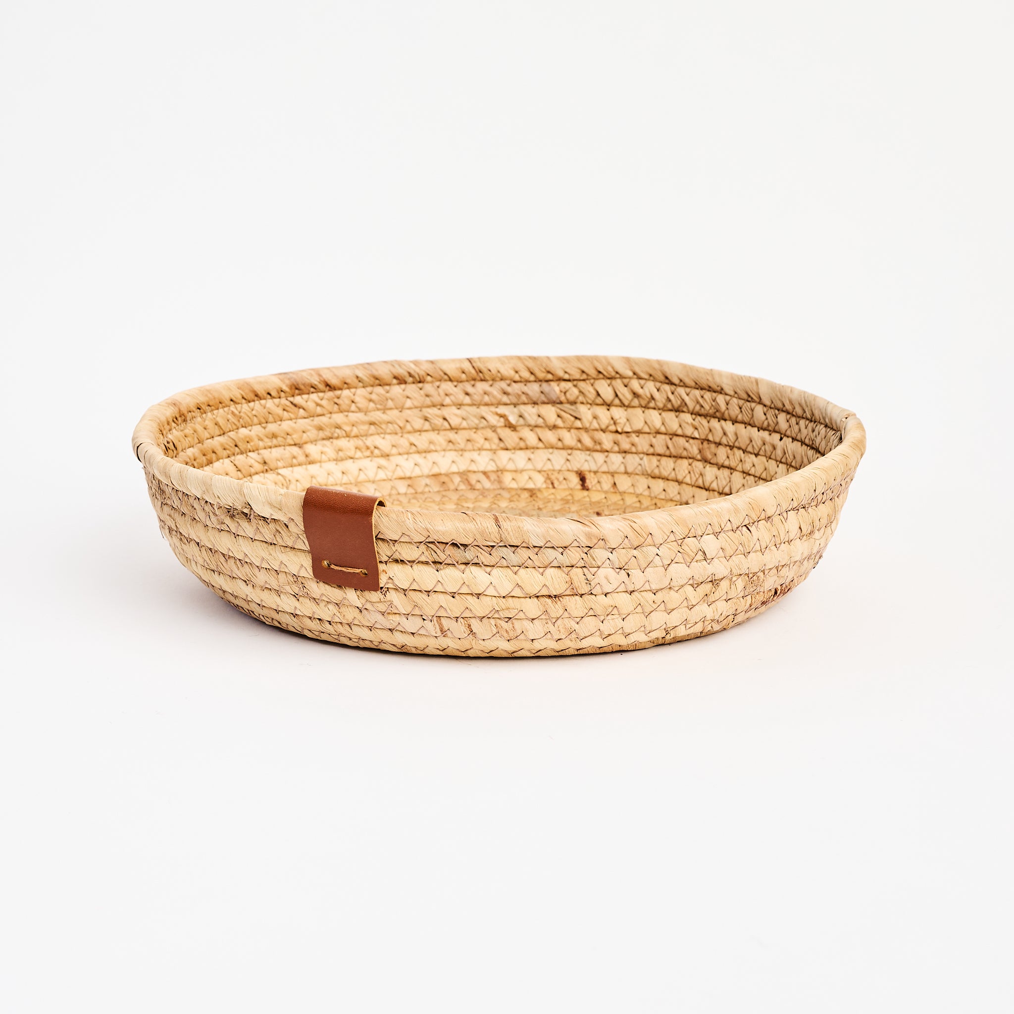 Seagrass & Hyacinth Woven Basket on a white background at Addison West