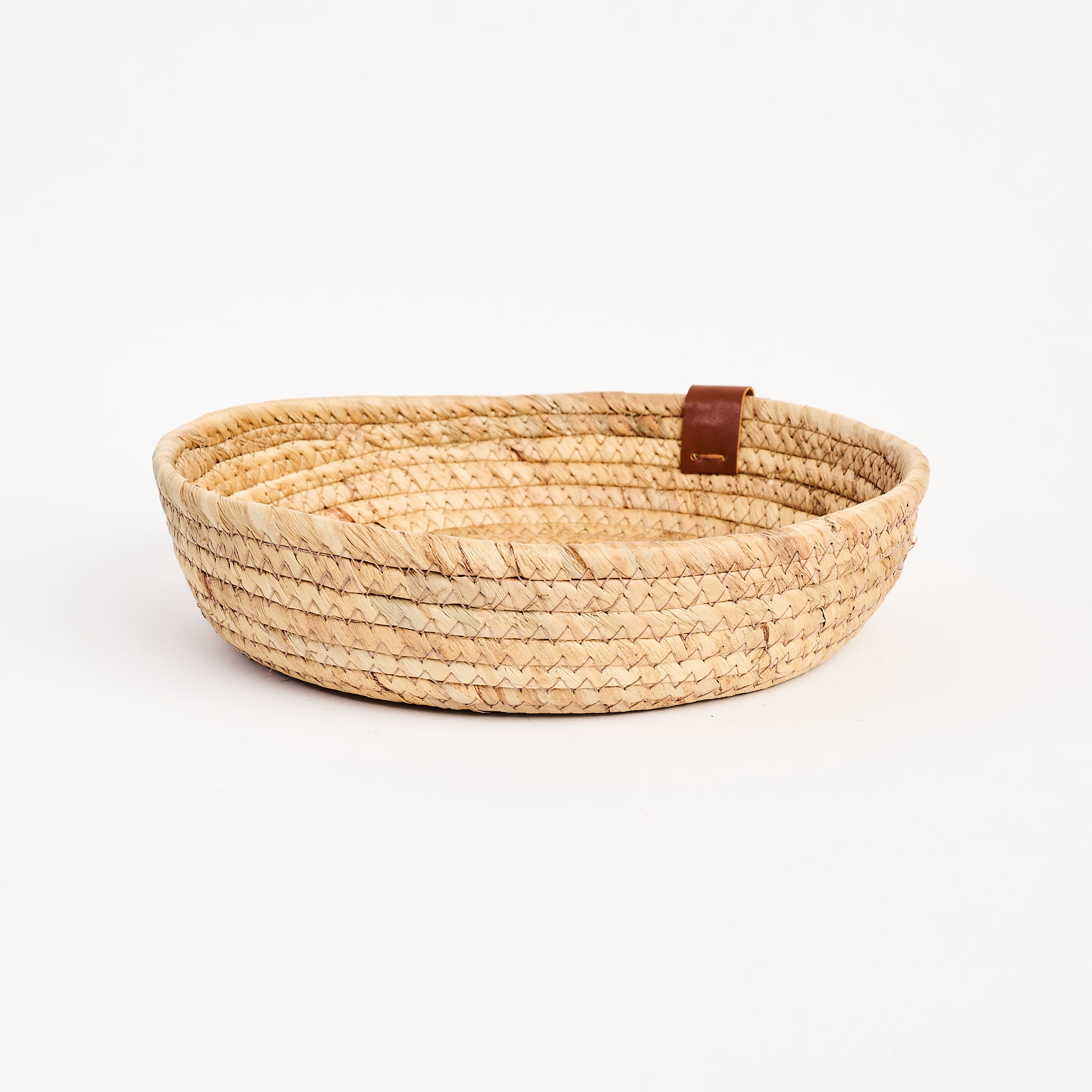 Seagrass & Hyacinth Woven Basket on a white background at Addison West