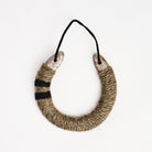Upcycled Lucky Horseshoe in Neutral Stripes on a white background at Addison West