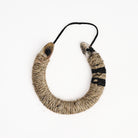 Upcycled Lucky Horseshoe in Neutral Stripes on a white background at Addison West