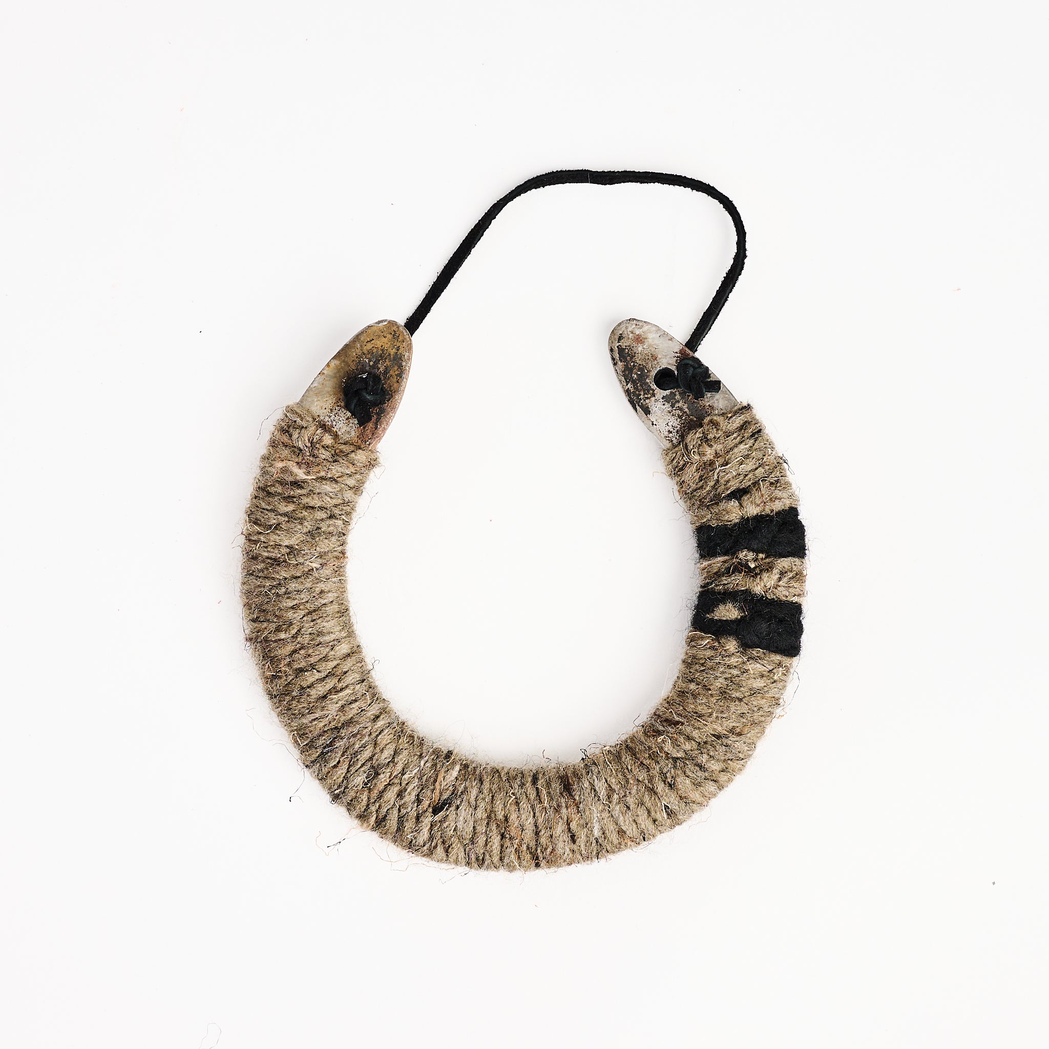 Upcycled Lucky Horseshoe in Neutral Stripes on a white background at Addison West
