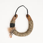 Upcycled Lucky Horseshoe in Brown Feather on a white background at Addison West