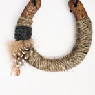 Upcycled Lucky Horseshoe in Brown Feather on a white background at Addison West