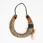Upcycled Lucky Horseshoe in Brown Feather on a white background at Addison West