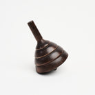 Spinning Wood Top on a white background at Addison West