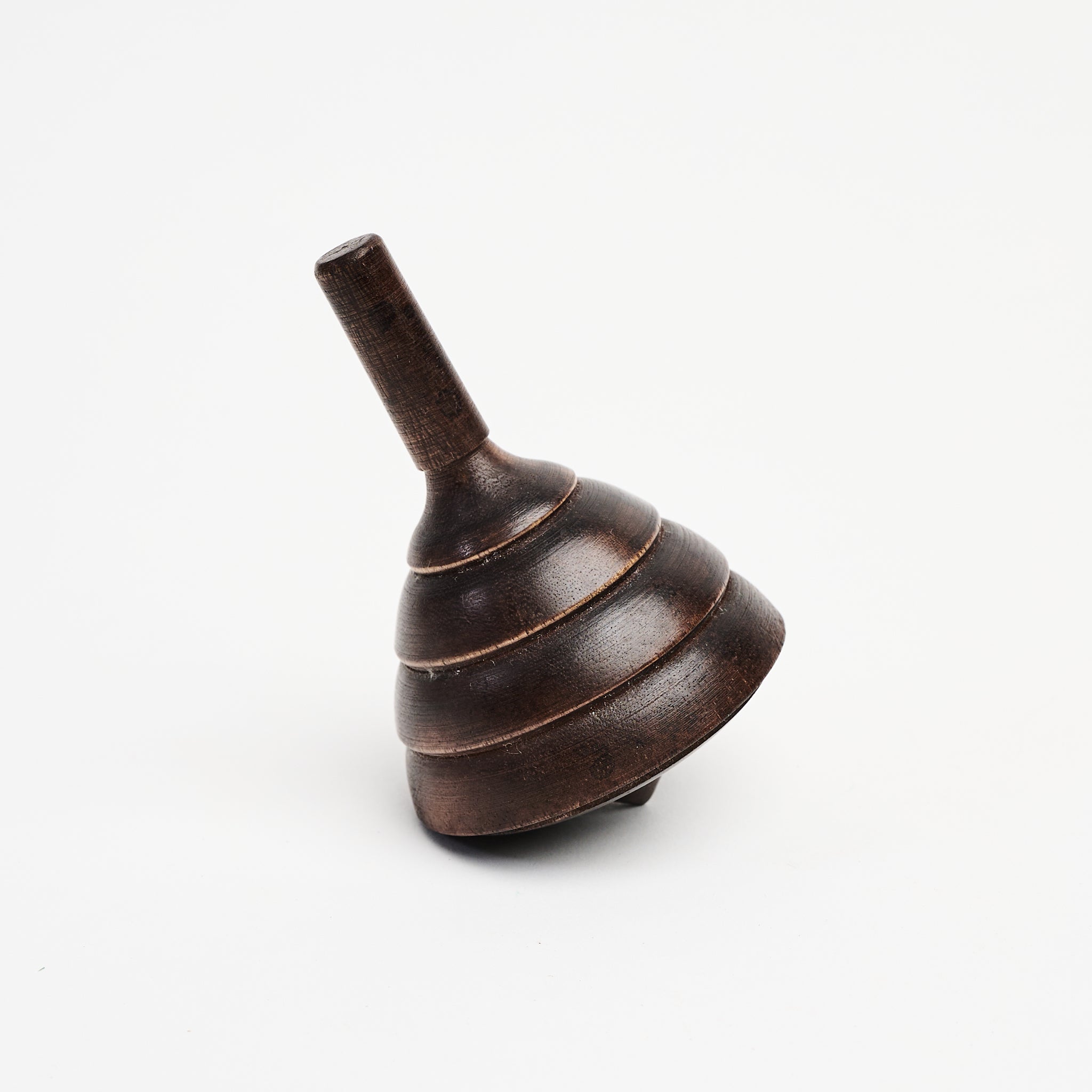 Spinning Wood Top on a white background at Addison West
