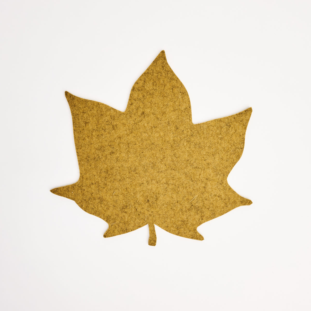 Graf Lantz Merino Wool Autumn Leaf Trivet in Ochre on a white background at Addison West