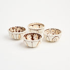 Stephanie Verdun Sauce Cup in Orange & Brown on a white background at Addison West