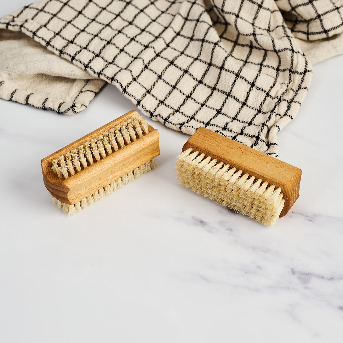 Redecker Classic Nail Brush on a marble table at Addison West