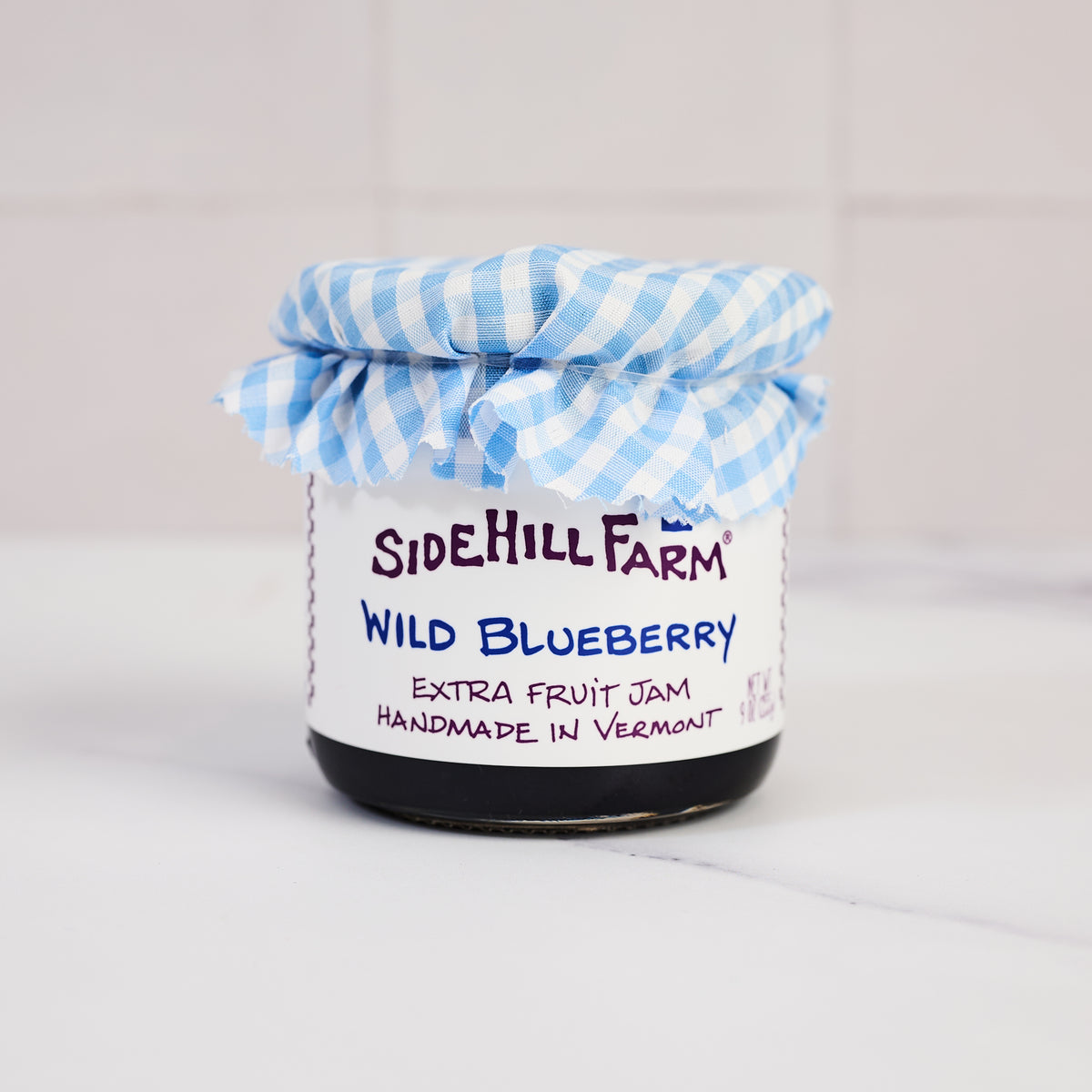 Sidehill Farm Wild Blueberry Jam on a kitchen counter at Addison West