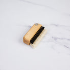 Redecker Laptop Brush on a marble table at Addison West