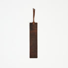 Genuine Leather Bookmark in Dark Brown on a white background at Addison West