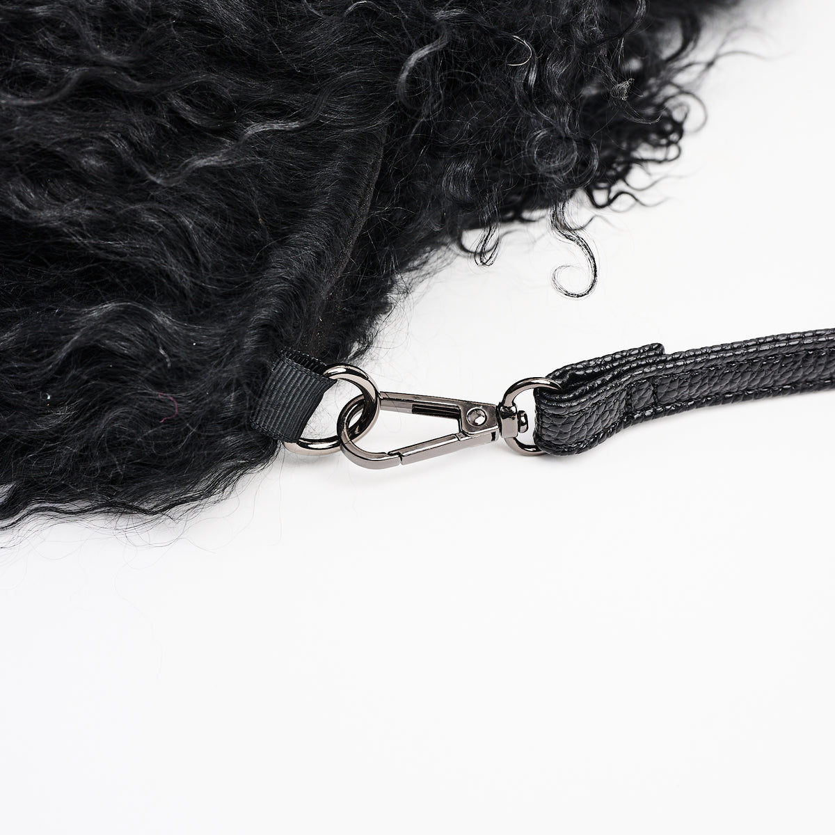 Jasmin Muff Bag in Solid Black on a white background at Addison West