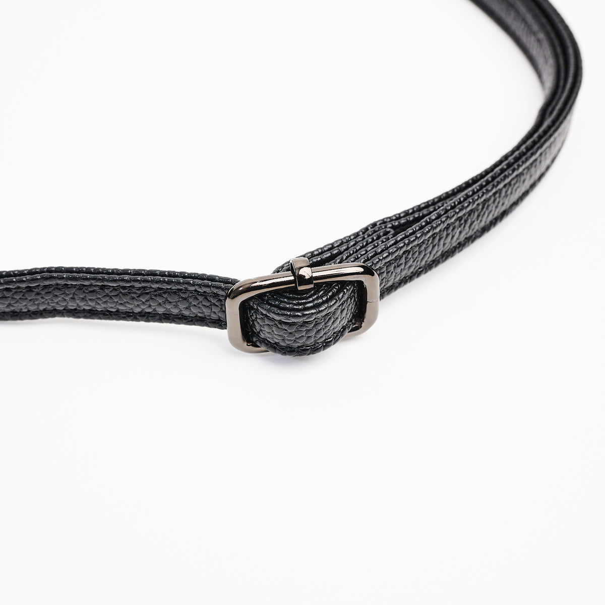 Jasmin Muff Bag in Solid Black on a white background at Addison West