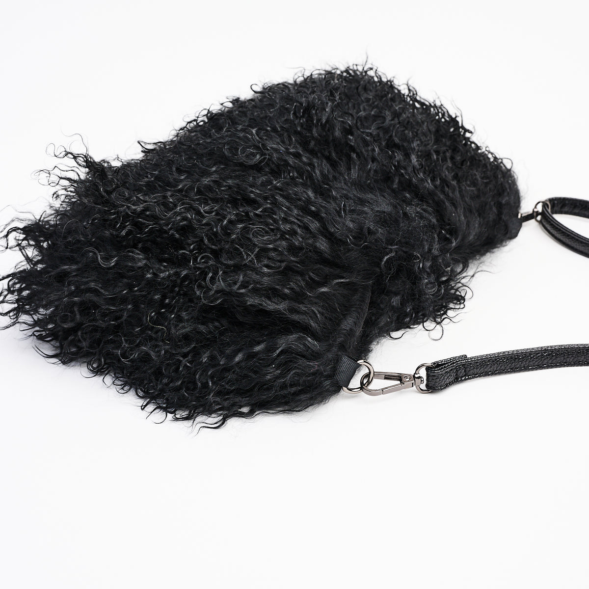 Jasmin Muff Bag in Solid Black on a white background at Addison West