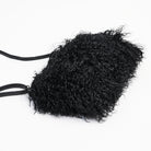 Jasmin Muff Bag in Solid Black on a white background at Addison West
