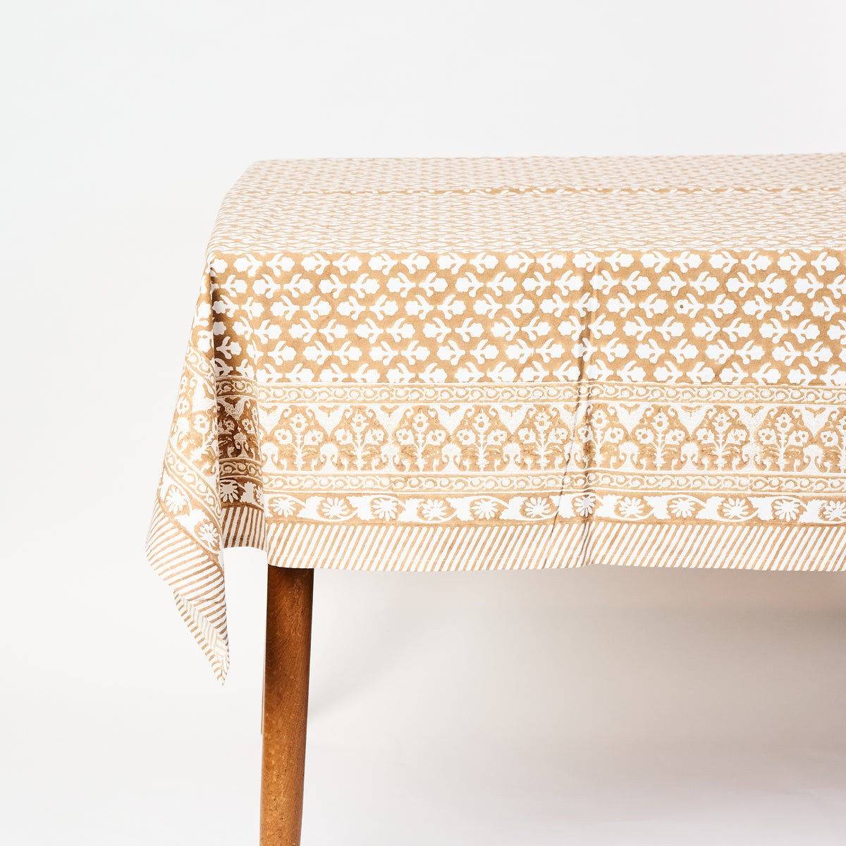 Charlotte Caramel Tablecloth on a white background at Addison West