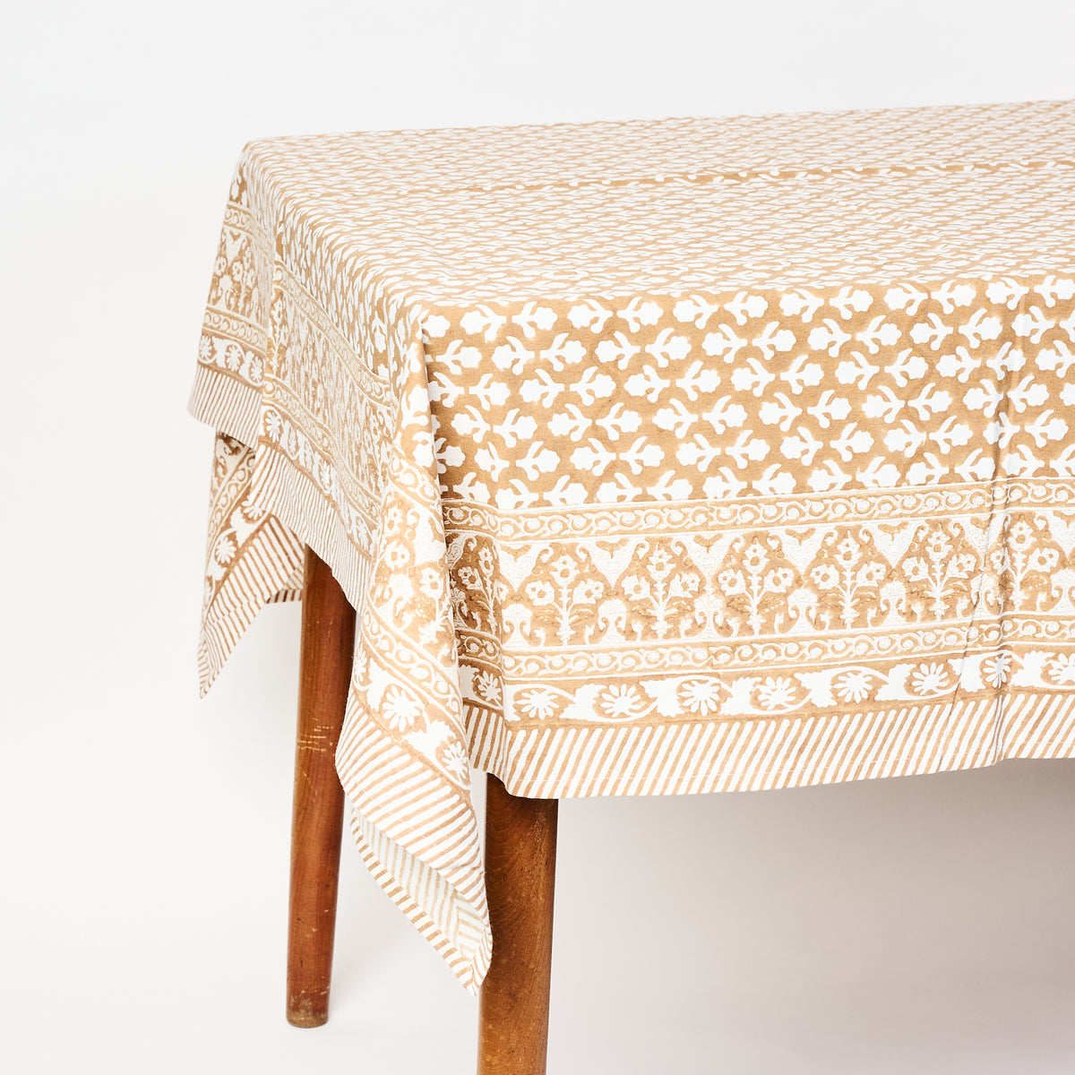 Charlotte Caramel Tablecloth on a white background at Addison West