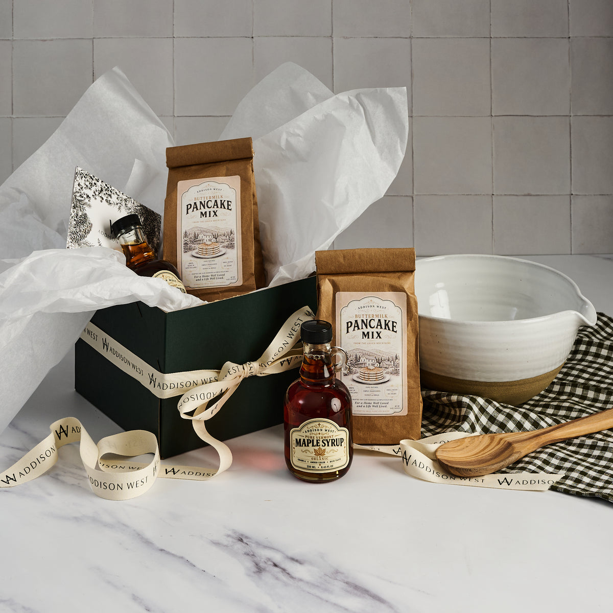 Addison West The Classic Gift Box with Vermont organic maple syrup and pancake mix on a kitchen counter at Addison West