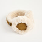 Lambswool And Suede Earmuffs in Camel on a white background at Addison West