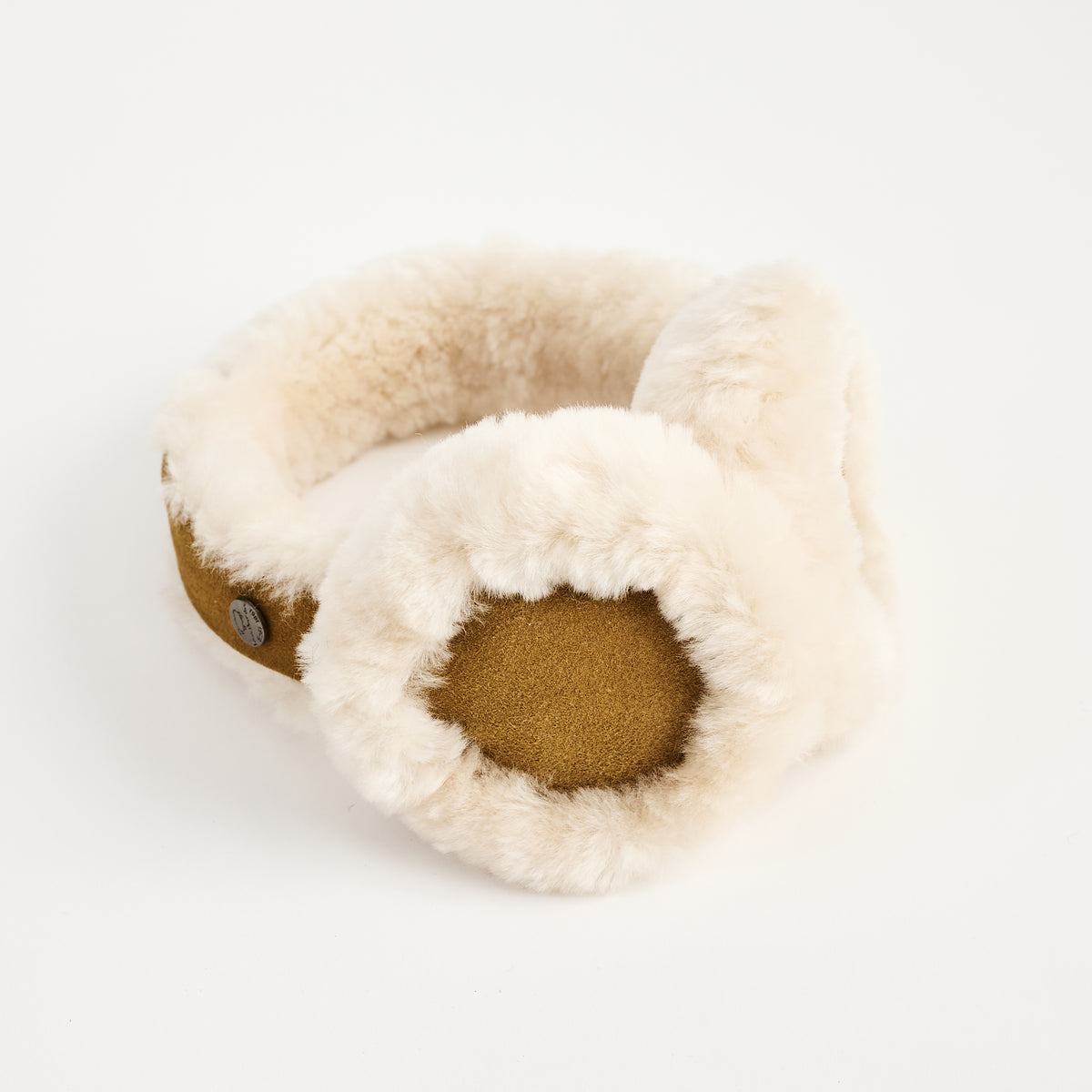 Lambswool And Suede Earmuffs in Camel on a white background at Addison West