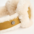 Lambswool And Suede Earmuffs in Camel on a white background at Addison West
