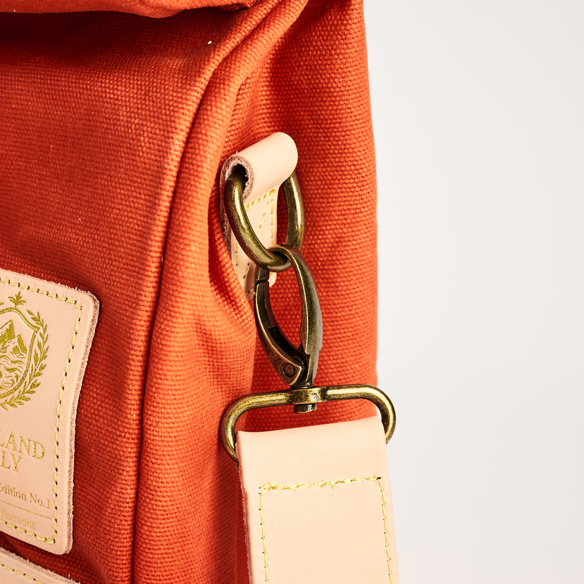 Insulated Field Bag in Hunter Orange on a white background at Addison West