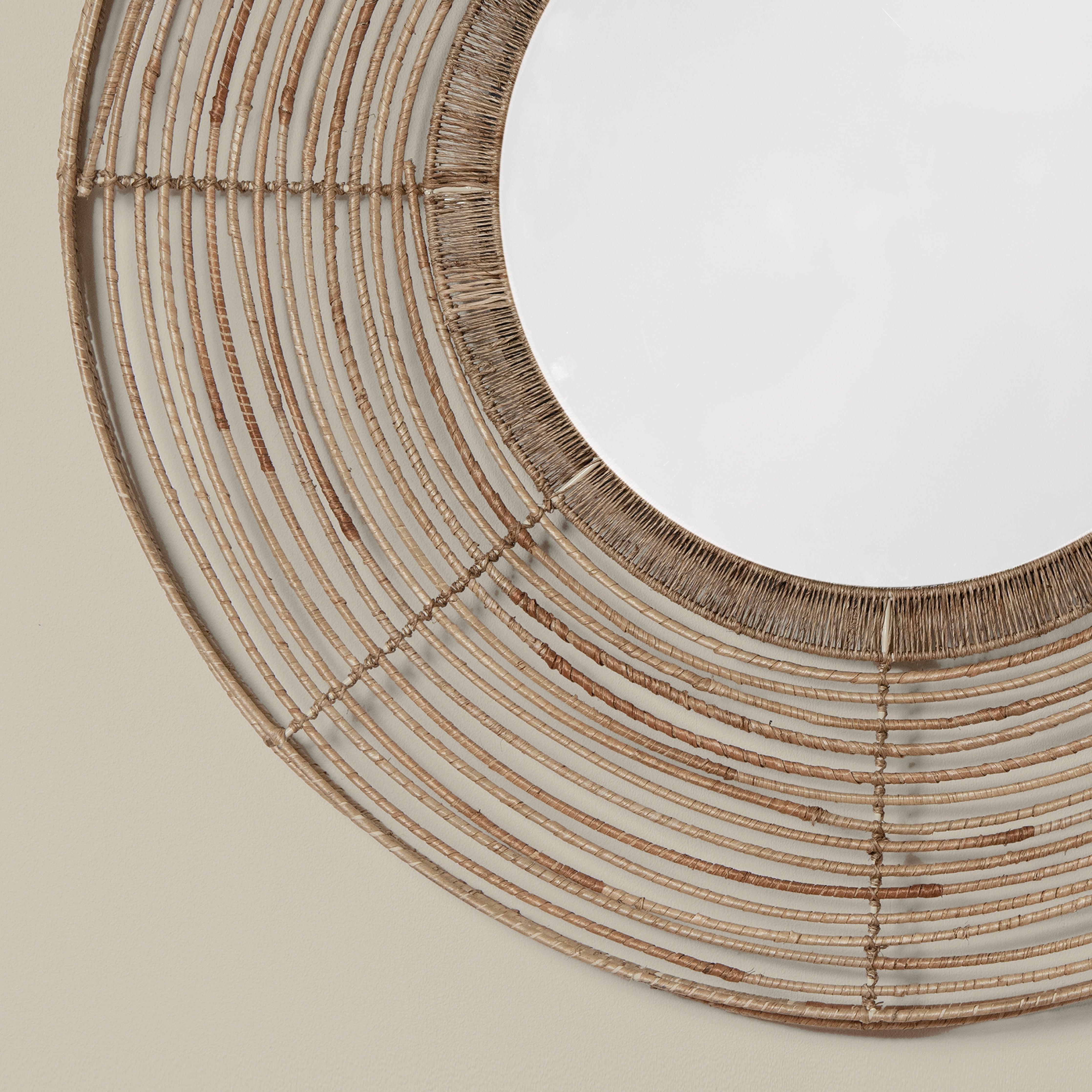 Close up of Beehive Round Mirror on a beige background at Addison West