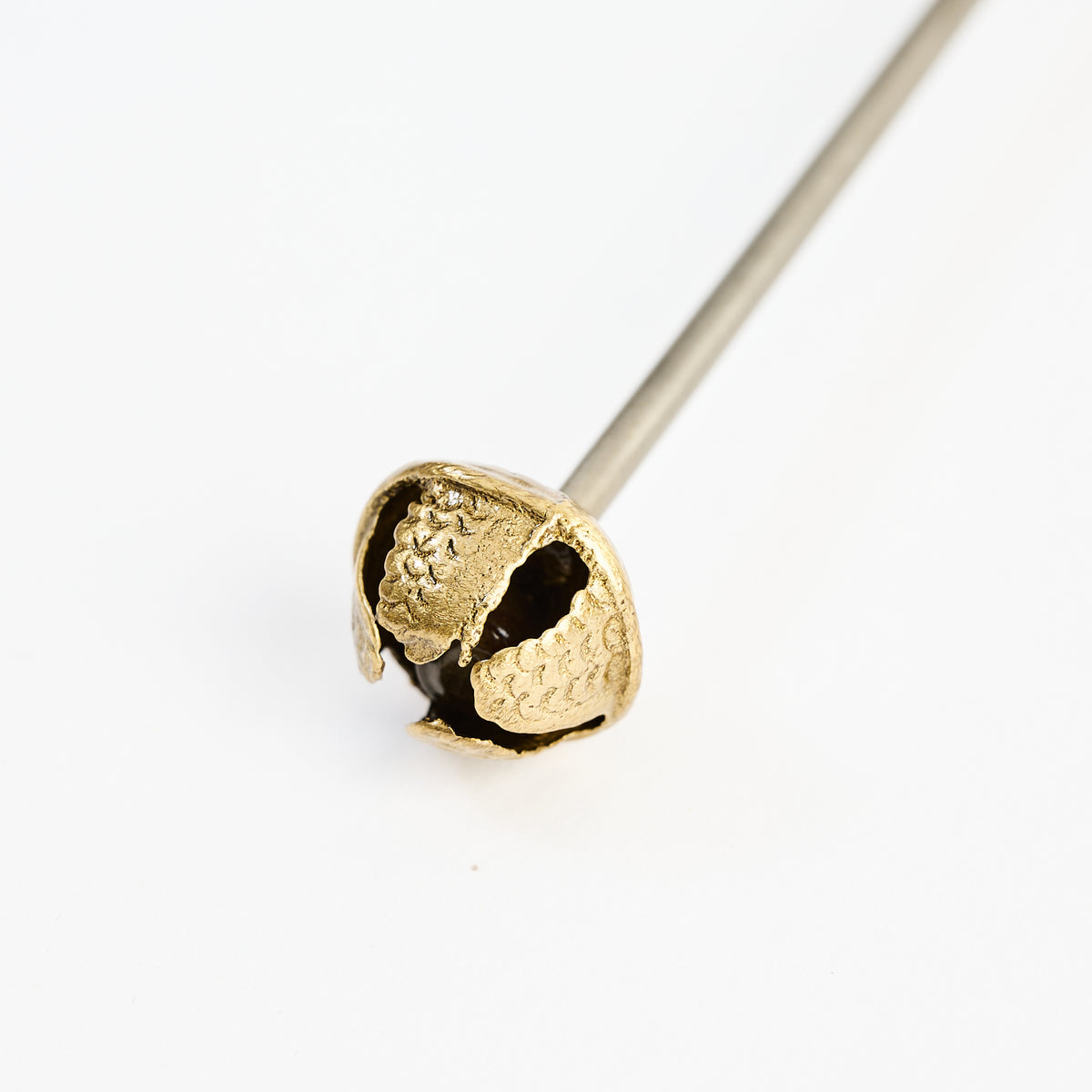 Holiday Bell Cocktail Stirrer on a white background at Addison West