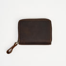 Zippered Small Leather Wallet in Dark Brown on a white background at Addison West