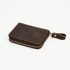 Zippered Small Leather Wallet in Dark Brown on a white background at Addison West