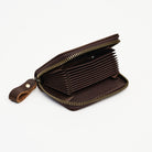 Zippered Small Leather Wallet in Dark Brown on a white background at Addison West