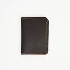Leather Vertical Bifold Wallet in Dark Brown on a white background at Addison West