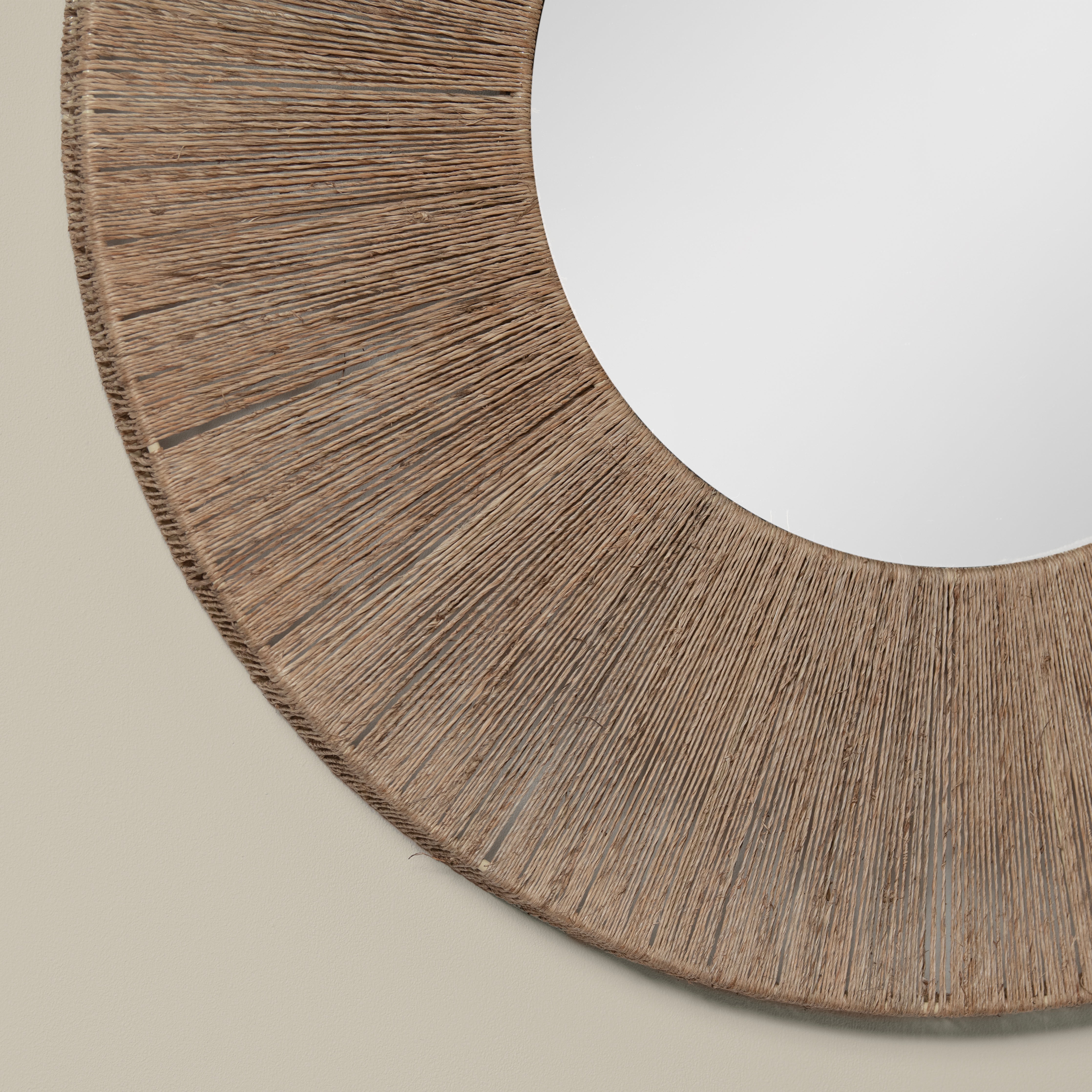 Close up of Highball Jute Round Mirror on a beige background at Addison West