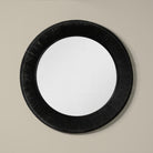 Collins Large Jute Mirror in Black on a beige wall at Addison West