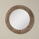 Folha Round Mirror in Natural on a beige background at Addison West