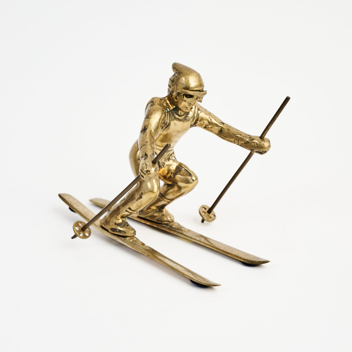 Vintage Brass Skier on a white background at Addison West