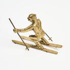 Vintage Brass Skier on a white background at Addison West
