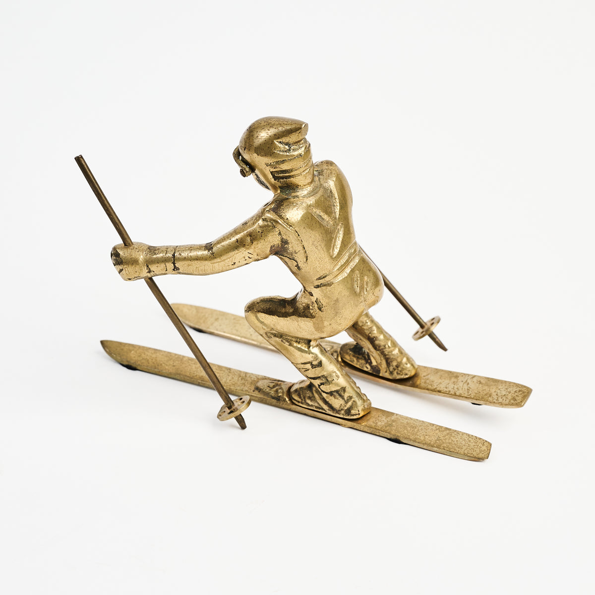 Vintage Brass Skier on a white background at Addison West