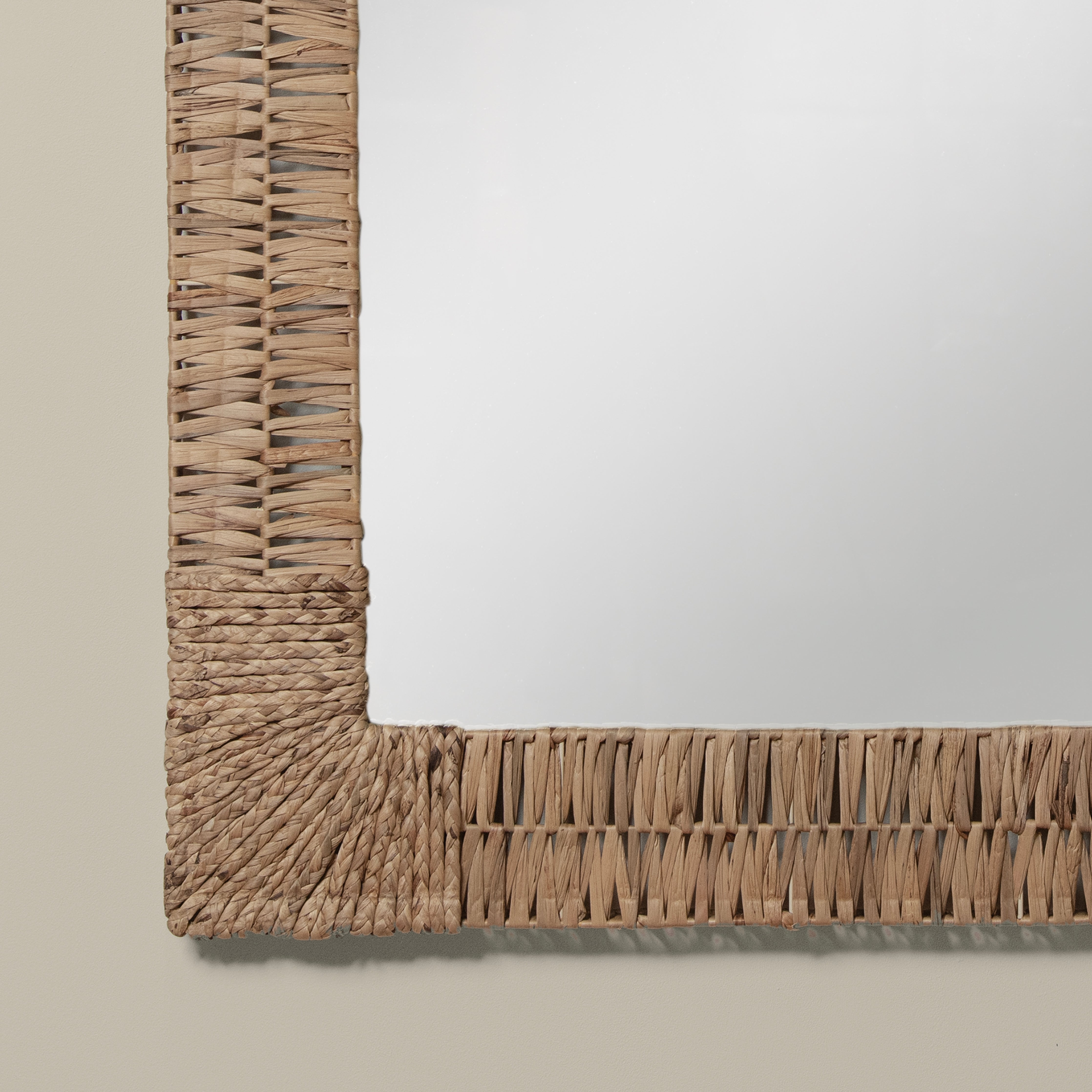 Close up of Folha Rectangular Mirror in Natural on a beige background at Addison West